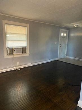 Lima house for rent - an empty living room with wood floors and a window