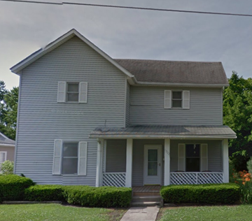Lima house for rent - a blue house with white siding and a porch