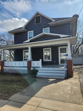 Lima house for rent - a blue house with a porch and white steps