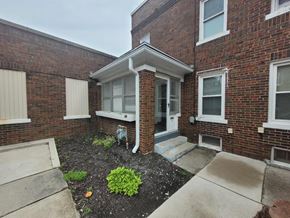 Lima apartment for rent - the front of a brick building with a porch and steps