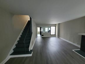 Lima apartment for rent - the living room and staircase of a house with a hard wood floor