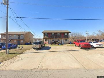 Choctaw apartment for rent - an empty parking lot in front of a house