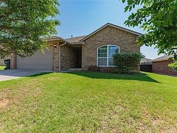 Yukon house for rent - a house with a lawn in front of it