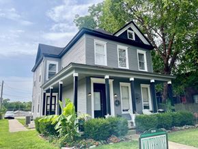 New Albany apartment for rent - a house with a blue roof and a sidewalk