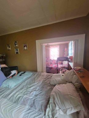 New Glasgow apartment for rent - a bedroom with a bed and a door to a closet