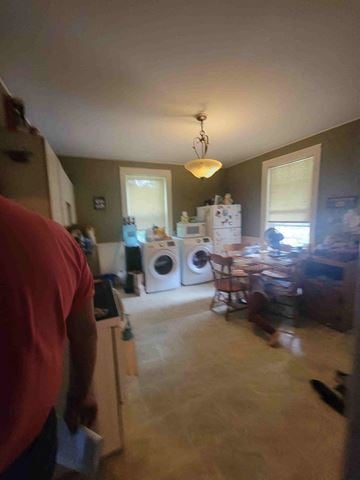 New Glasgow apartment for rent - a kitchen with a washing machine and a table in it