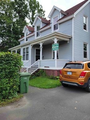 New Glasgow apartment for rent - A house with a sign that says "The All" is for sale.