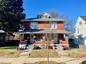 New Albany apartment for rent - A red brick house with a white door and windows.