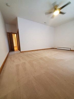 Bluffton house for rent - an empty room with wooden floors and a ceiling fan