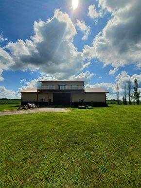 Bluffton house for rent - a large building in the middle of a grass field