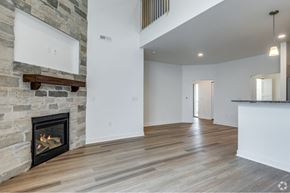 Oshkosh townhouse for rent - the living room with a fireplace in a new home