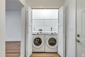 Oshkosh townhouse for rent - a washer and dryer in a laundry room with a sink and a window