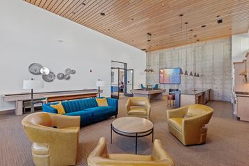 Coeur D'alene apartment for rent - a living room with couches and chairs and a table