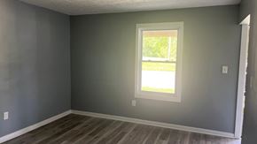 Akron apartment for rent - A room with a window and grey walls.