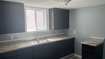 Akron apartment for rent - A kitchen with a sink and a window.
