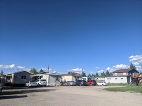 Driggs apartment for rent - a group of trailers and cars parked in a parking lot