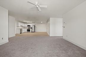 Driggs apartment for rent - an empty living room and kitchen with a ceiling fan