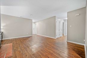Jacksonville house for rent - A room with wooden floors and white walls.