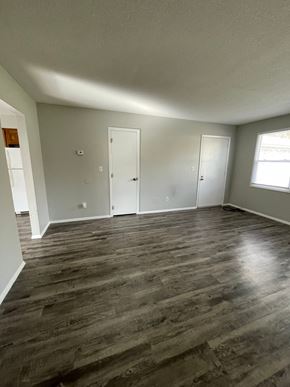 Cridersville apartment for rent - an empty living room with wooden floors and white walls