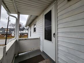 Lima apartment for rent - the front porch of a white house with a white door