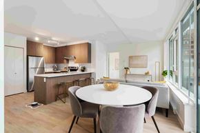 Coquitlam apartment for rent - A modern kitchen with a dining table and chairs.
