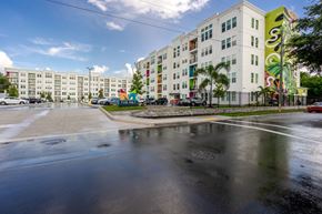 Bradenton apartment for rent - an empty street in front of an apartment building with graffiti on it