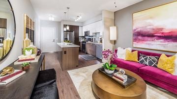 San Jose apartment for rent - a living room and kitchen with a pink couch