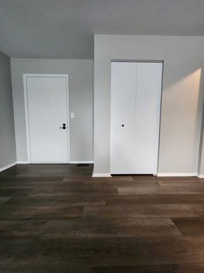 Lima apartment for rent - a living room with white walls and two doors