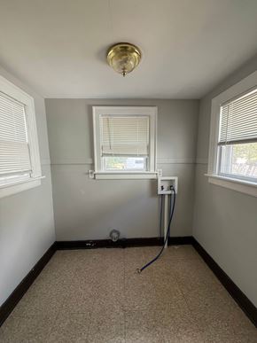 Lima house for rent - A room with a window, a sink, and a vacuum cleaner.