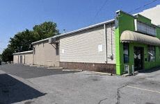 Hagerstown apartment for rent - a green and white building on the side of a street