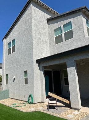 Goodyear house for rent - a gray house with a ramp in front of it