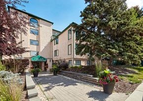 Edmonton apartment for rent - a view of a building with a pathway in front of it