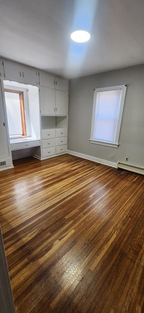 Lima house for rent - a living room with a hard wood floor and white cabinets