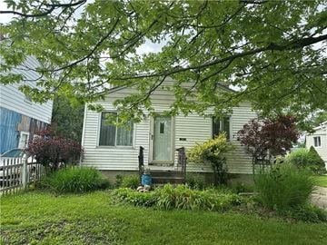 Cleveland house for rent - a white house with a yard in front of it