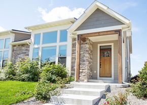 Bozeman apartment for rent - the front of a house with stairs and a wooden door