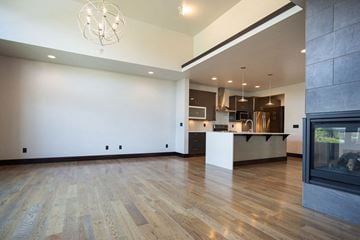 Bozeman apartment for rent - a living room with a fireplace and a kitchen