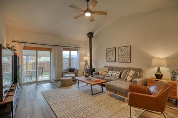 Pagosa Springs house for rent - a living room with a couch and a ceiling fan