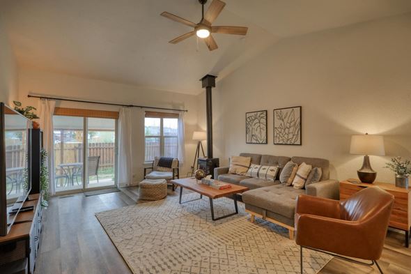 Pagosa Springs house for rent - a living room with a couch and a ceiling fan