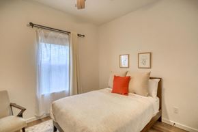 Pagosa Springs house for rent - a bedroom with a large white bed and a window
