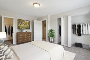 Laurel apartment for rent - a bedroom with a bed and a dresser and a closet