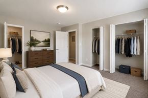 Laurel apartment for rent - A bedroom with a large bed and a wardrobe.