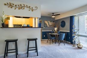 Laurel apartment for rent - a dining room with a bar and a table and chairs