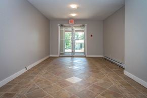 Fruitvale apartment for rent - A room with a tiled floor and a door leading outside.