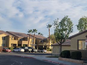 Coachella multi-family for rent - A row of houses with cars parked in front.