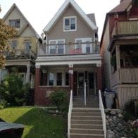 Milwaukee apartment for rent - the front of a house with stairs in front of it