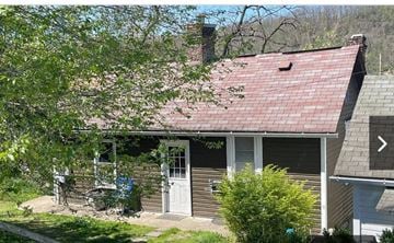 Morgantown apartment for rent - a small house with a red roof and a white door