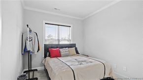 Spring Lake house for rent - a white bedroom with a bed and a window