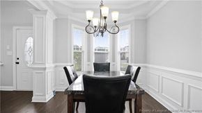 Spring Lake house for rent - a dining room with a table and chairs and a chandelier