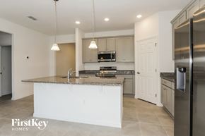 Bartow house for rent - a kitchen with a large island and stainless steel appliances
