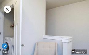 Duncan house for rent - a laundry room with a white chair and a washing machine